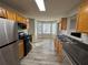 Eat-in kitchen with stainless steel appliances and vinyl flooring at 916 Brisley Cir, Hampton, GA 30228