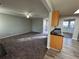 Open concept living and kitchen area with carpet and vinyl flooring at 916 Brisley Cir, Hampton, GA 30228