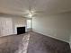 Bright living room with a fireplace and ceiling fan at 916 Brisley Cir, Hampton, GA 30228