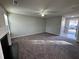 Spacious living room featuring a fireplace and neutral carpeting at 916 Brisley Cir, Hampton, GA 30228