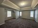 Large main bedroom with tray ceiling and carpet at 916 Brisley Cir, Hampton, GA 30228