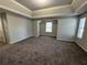Spacious main bedroom with high ceilings and carpet at 916 Brisley Cir, Hampton, GA 30228
