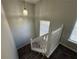 Elegant staircase with white railing and carpeted steps at 916 Brisley Cir, Hampton, GA 30228