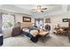 Large main bedroom with a king-size bed and ensuite bathroom at 5175 Skidaway Dr, Johns Creek, GA 30022