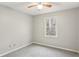 Well-lit bedroom with a ceiling fan and a view of the woods at 634 Stratford Grn, Avondale Estates, GA 30002