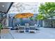 Outdoor seating area with fire pit and stylish umbrella at 2188 Niles Pl, Atlanta, GA 30324