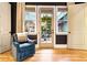 French doors open to a cozy backyard patio with seating at 2188 Niles Pl, Atlanta, GA 30324