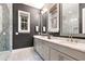 Elegant bathroom with double vanity, large mirror and glass shower at 2188 Niles Pl, Atlanta, GA 30324