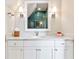 Bathroom with white vanity, marble countertop, and teal tile shower at 2188 Niles Pl, Atlanta, GA 30324