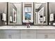 Double vanity bathroom with marble countertops and large mirrors at 2188 Niles Pl, Atlanta, GA 30324