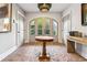 Elegant entryway with herringbone floors and arched doors at 2188 Niles Pl, Atlanta, GA 30324