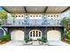 Stunning townhome exterior with large front porch and two-car garage at 2188 Niles Pl, Atlanta, GA 30324