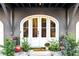 Elegant front entrance with arched double doors and landscaping at 2188 Niles Pl, Atlanta, GA 30324