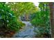 Stone path meanders through a tranquil, lush garden at 2188 Niles Pl, Atlanta, GA 30324