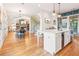 Open floor plan with kitchen island, dining area, and hardwood floors at 2188 Niles Pl, Atlanta, GA 30324