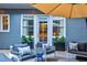 Private patio with outdoor furniture and umbrella at 2188 Niles Pl, Atlanta, GA 30324