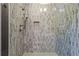 Walk-in shower with hexagonal tile and dual shower heads at 2188 Niles Pl, Atlanta, GA 30324
