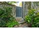 Gray wooden gate with stone steps and lush landscaping at 2188 Niles Pl, Atlanta, GA 30324