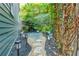 Stone path, lush greenery, and solar lights create a charming side yard at 2188 Niles Pl, Atlanta, GA 30324