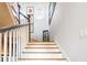 Bright staircase with white risers and gray railing at 2188 Niles Pl, Atlanta, GA 30324
