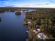 Lakefront property showcasing a modern home and surrounding landscape at 2746 Emerald Dr, Jonesboro, GA 30236