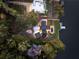 Bird's-eye view of a modern home, pool, and private dock on the lake at 2746 Emerald Dr, Jonesboro, GA 30236