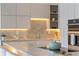 Gourmet kitchen showcasing modern cabinetry, stone countertops, and high-end appliances at 2746 Emerald Dr, Jonesboro, GA 30236