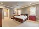 Spacious bedroom with a large bed, sitting area, and ensuite bathroom at 4755 Riverview Rd, Atlanta, GA 30327