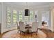 Charming dining area features bay windows and a round table at 4755 Riverview Rd, Atlanta, GA 30327