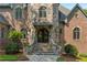 Stone entryway with arched double doors and steps at 4755 Riverview Rd, Atlanta, GA 30327