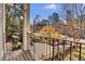 Balcony with wooden deck overlooking a park-like setting at 935 Piedmont Ave # 201, Atlanta, GA 30309