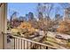 Balcony view overlooking a tree-lined street and cityscape at 935 Piedmont Ave # 201, Atlanta, GA 30309