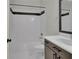 Clean bathroom with a shower/tub combo and white tile at 935 Piedmont Ave # 201, Atlanta, GA 30309