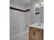 Clean bathroom with tub, shower, and updated vanity at 935 Piedmont Ave # 201, Atlanta, GA 30309