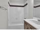Clean bathroom with tub, shower, and updated vanity at 935 Piedmont Ave # 201, Atlanta, GA 30309