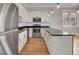 Modern kitchen with stainless steel appliances and hardwood floors at 935 Piedmont Ave # 201, Atlanta, GA 30309