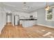 Open concept kitchen with island and hardwood floors at 935 Piedmont Ave # 201, Atlanta, GA 30309