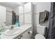 Bright bathroom featuring a vanity, toilet, and shower at 524 Granite Ridge Pl, Atlanta, GA 30350