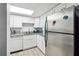 Galley kitchen with white cabinets and granite counters at 524 Granite Ridge Pl, Atlanta, GA 30350