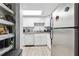 Galley kitchen with white cabinets and granite counters at 524 Granite Ridge Pl, Atlanta, GA 30350