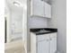 Small kitchenette with white cabinets and a sink at 524 Granite Ridge Pl, Atlanta, GA 30350