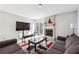 Modern living room with fireplace, large TV, and lots of natural light at 524 Granite Ridge Pl, Atlanta, GA 30350