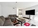 Spacious living room with large TV and comfortable seating at 524 Granite Ridge Pl, Atlanta, GA 30350