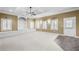 Large basement recreation room with built-ins and neutral walls at 1584 Fernstone Nw Cir, Acworth, GA 30101