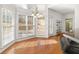 Bright breakfast area with hardwood floors, large windows and access to the backyard at 4008 Creekview Ridge Ct, Buford, GA 30518