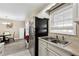 Kitchen with stainless steel appliances and white cabinets at 992 Old Holcomb Bridge Rd, Roswell, GA 30076