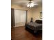 Cozy bedroom with hardwood floors, window, and ceiling fan at 3957 Birdie Dr, Douglasville, GA 30134