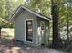 Exterior view of a storage shed with a black door and window at 2401 Westland Way, Acworth, GA 30102