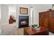 Gas fireplace with stone surround, in between two rooms at 2125 Fairfax Dr, Alpharetta, GA 30009