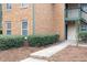 Brick building exterior with manicured hedges and a walkway at 600 Bedfort Dr, Duluth, GA 30096